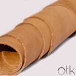 Buffalo Polinisia chestnut leather rolled up