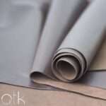 Rolled Cyclone Choco Brown Finished Leather displayed on a flat surface