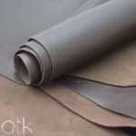 Smooth surface of Cyclone Choco Brown Finished Leather rolled up