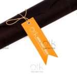 Horween leather roll tied with a branded orange tag.
