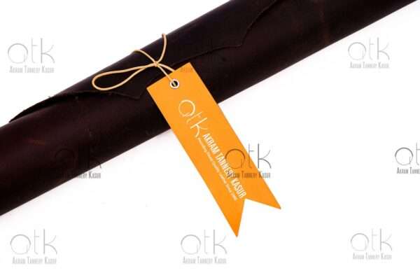 Horween leather roll tied with a branded orange tag.