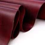 Richly hued maroon pull-up leather suitable for fashion-forward leather pieces.