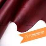 Richly hued maroon pull-up leather suitable for fashion-forward leather pieces.