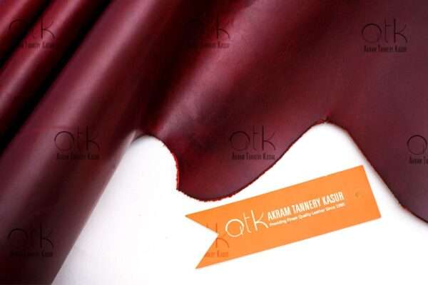 Richly hued maroon pull-up leather suitable for fashion-forward leather pieces.