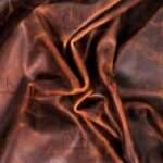 Ranger tan Horween pull-up leather in natural folds.