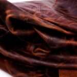Horween leather sheets in ranger tan with natural distressed look.