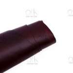 Elegant maroon pull-up leather for luxurious handcrafted bags and belts.