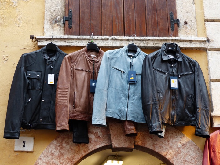 Leather Jackets Are Hanging on The Street Wall